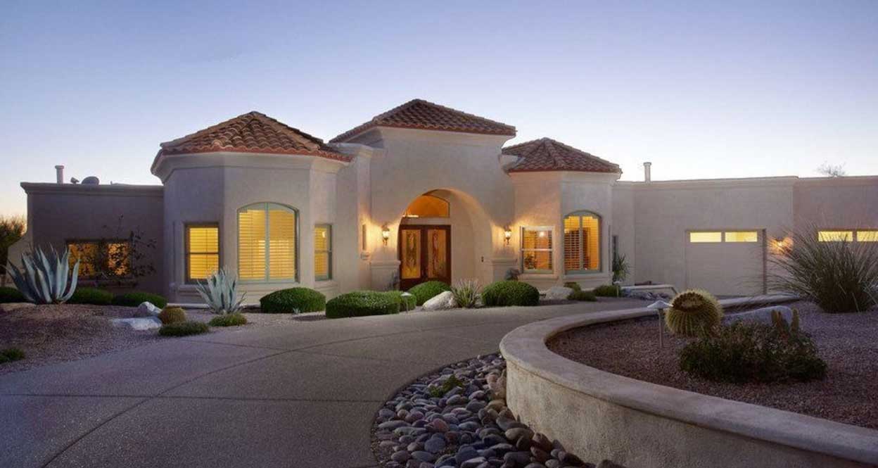 A curved driveway leading to a hosue built by our Tucson custom home builders