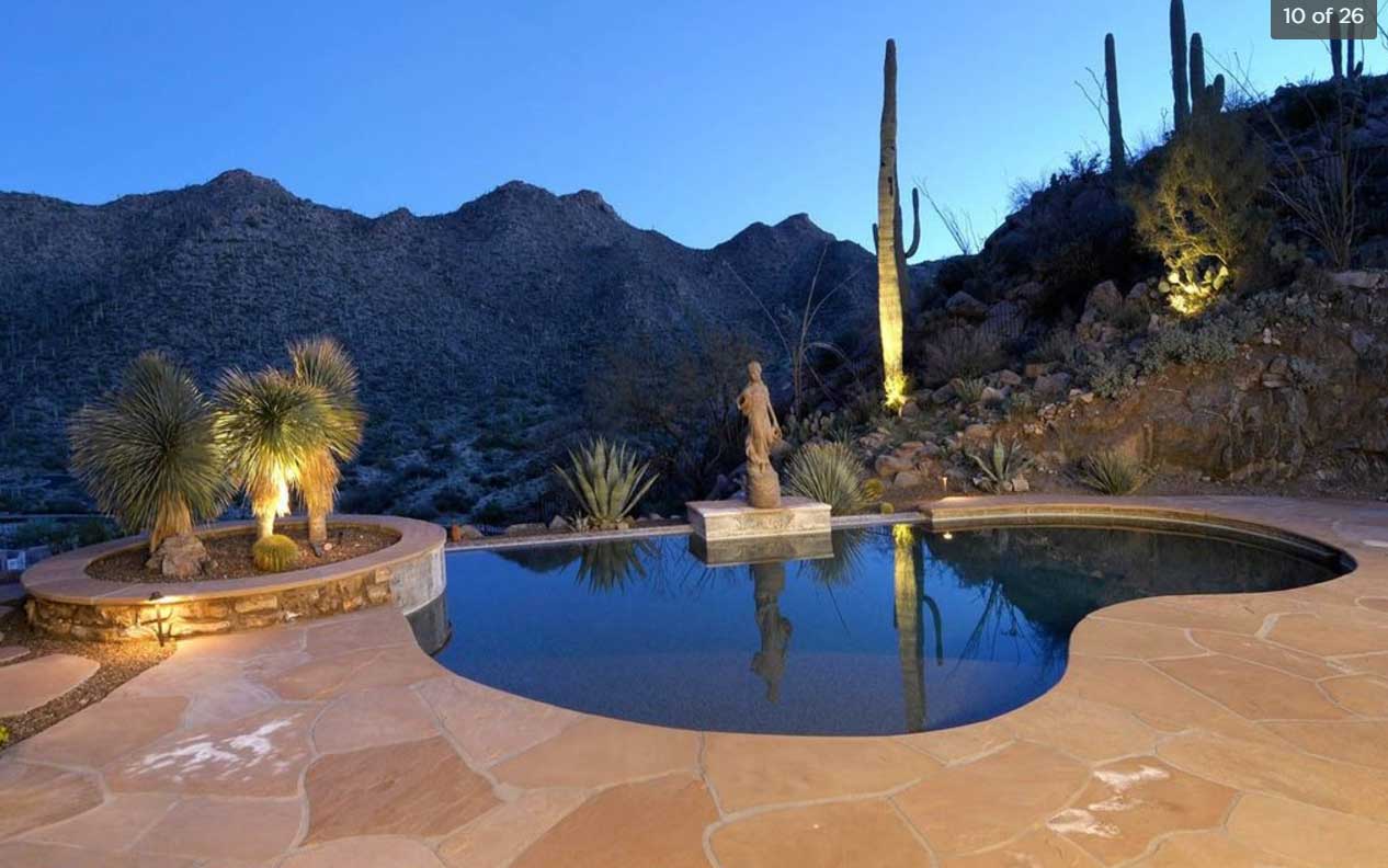 A pool in the backyard of a custom home in Canyon Pass with a gorgeous desert view
