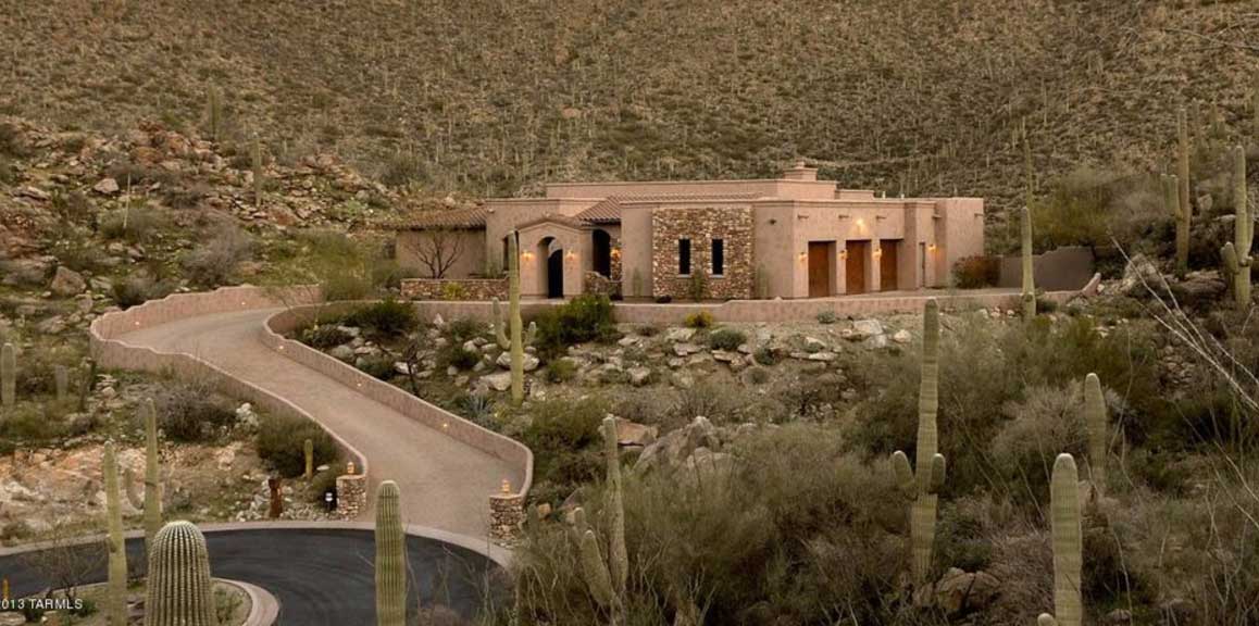 A long driveway leading to a home built by our Tucson custom home builders in a gorgeous desert setting
